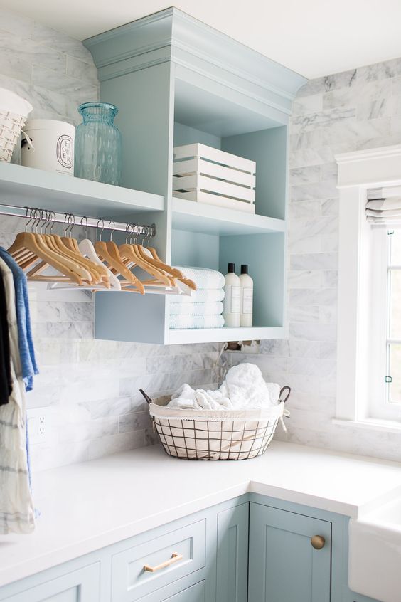 Laundry room update with blue cabinets and gray marble accent walls