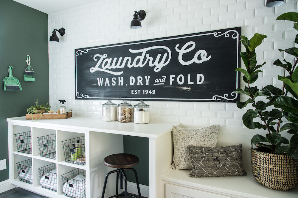 Organized rustic farmhouse laundry room showcased on Fixer Upper