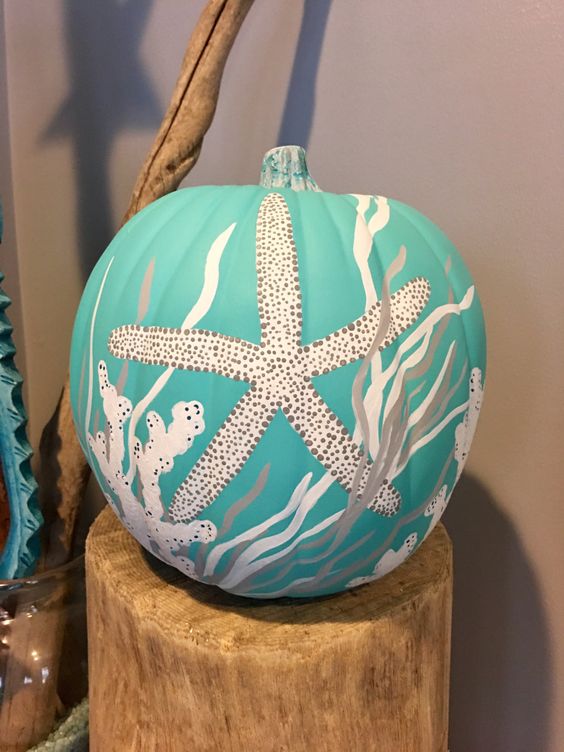Incorporate an ocean-blue painted pumpkin into your coastal home decor this fall. 