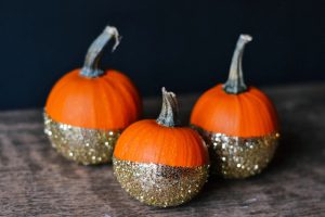 Go glam this fall by decorating your pumpkin with glitter using a dip-dyed look that will carry over from Halloween to Thanksgiving.