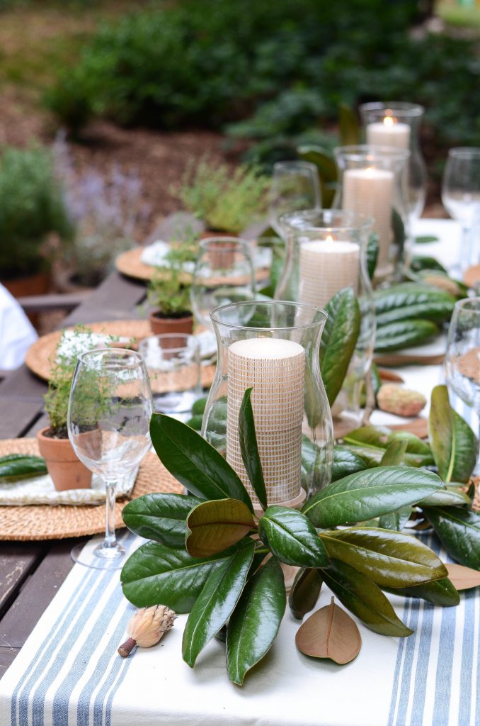 Outdoor Thanksgiving decor inspiration using greenery and candles