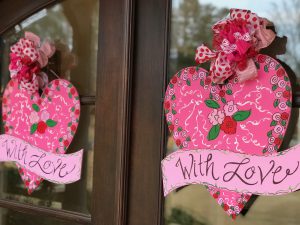 Festive pink Valentine's Day door hangers