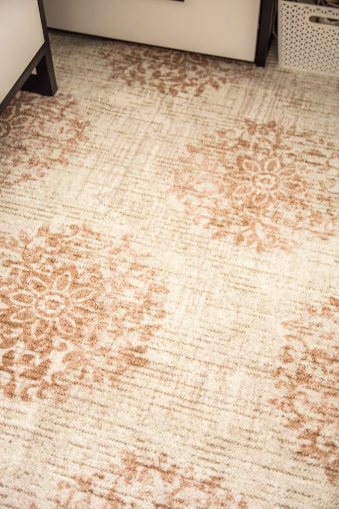 The floral design in the Relic Jardin area rug by Mohawk Home is subtle with a bit of a vintage feel.