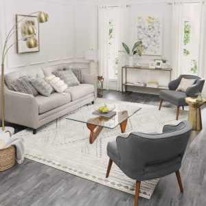 8x10 Nomad Vado area rug shown with soft and two side chairs and coffee table