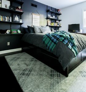 Teen boy bedroom interior with Mohawk Home Russell Plaid area rug